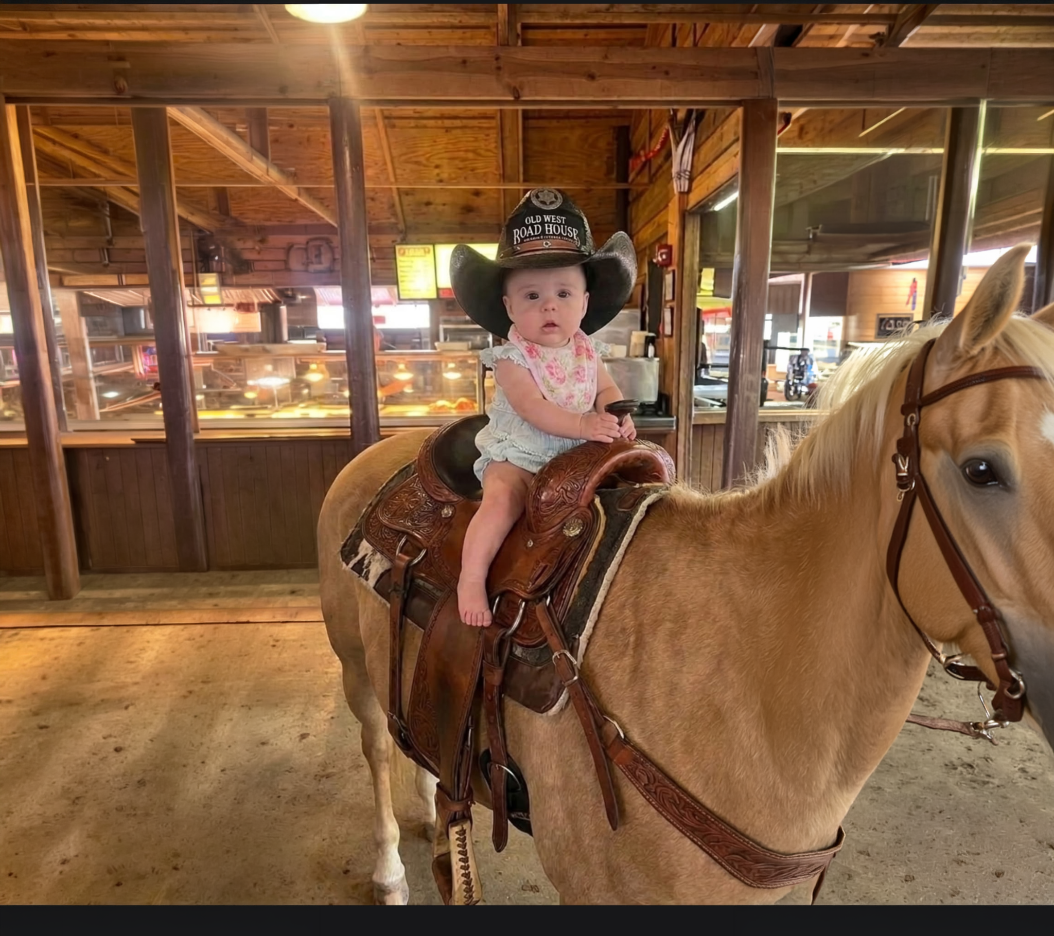 The owner's granddaughter sitting on a horse at the Old West Road House